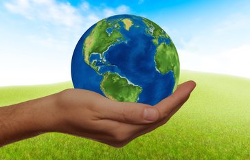 earth in a person's hand