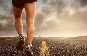 jogger running on road