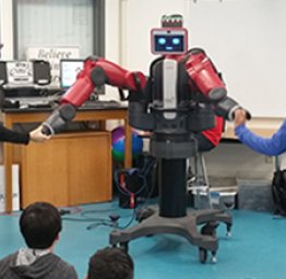 students interacting with a large robot