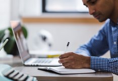 adult working on computer
